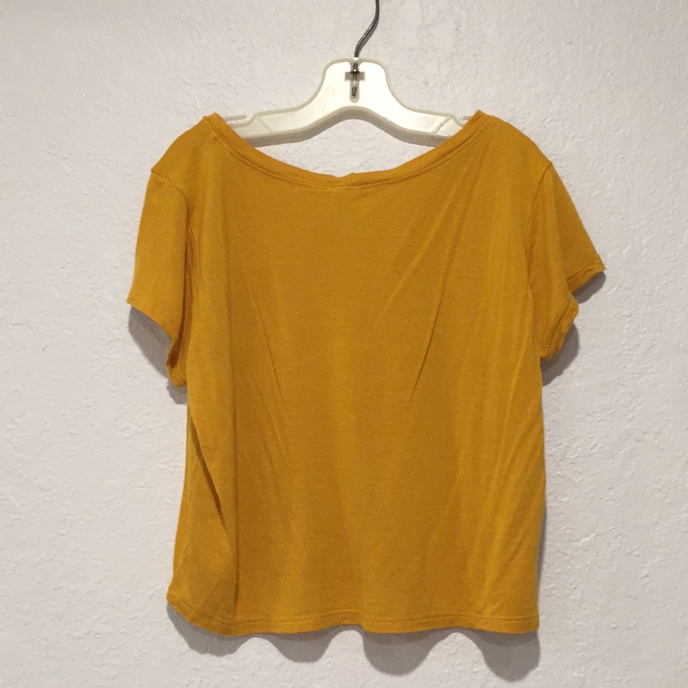 Cropped yellow shirt.